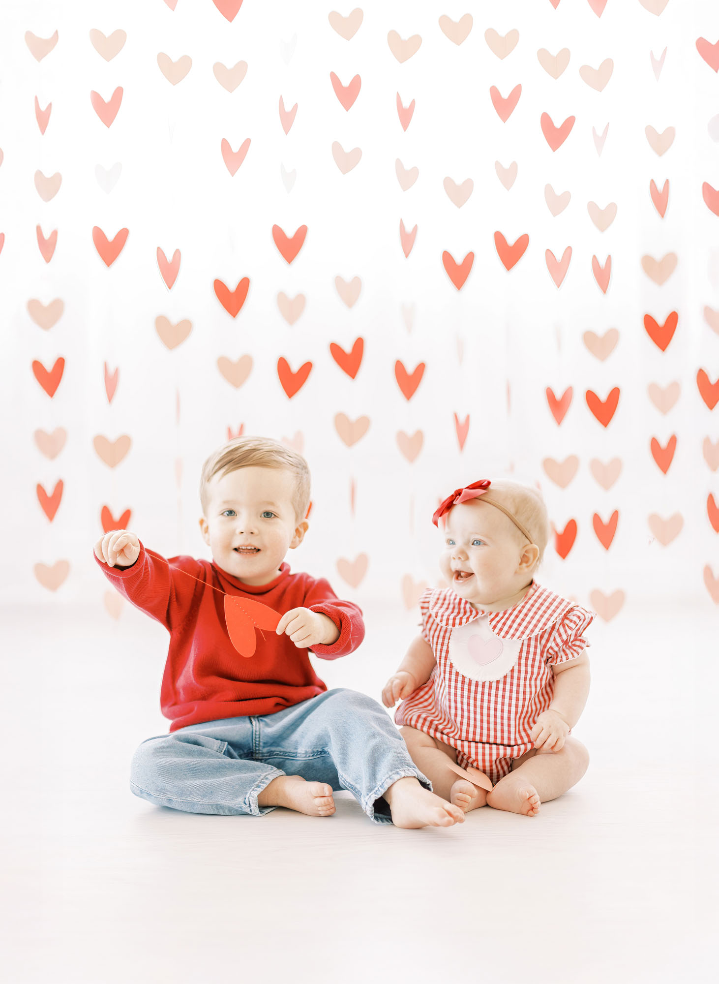 Siblings dressed up for Valentine's day on studio set